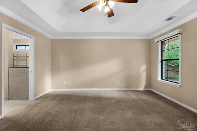 unfurnished room featuring ceiling fan, carpet floors, and crown molding