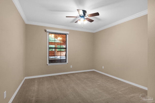 carpeted empty room featuring ornamental molding and ceiling fan