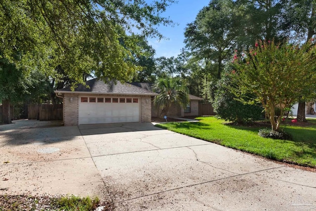 single story home with a garage and a front yard