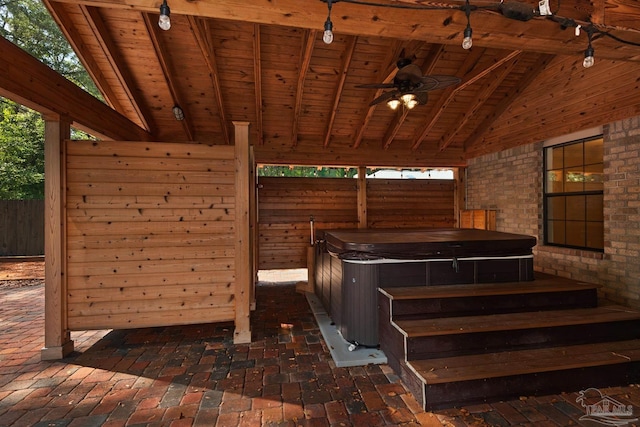 miscellaneous room featuring a healthy amount of sunlight, wood ceiling, beamed ceiling, and high vaulted ceiling