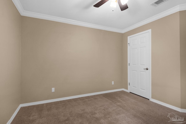 spare room with carpet flooring, ornamental molding, and ceiling fan