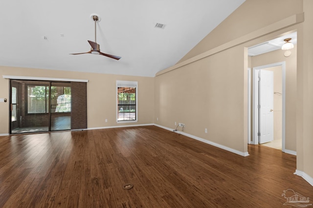 unfurnished living room featuring vaulted ceiling, dark hardwood / wood-style flooring, and ceiling fan