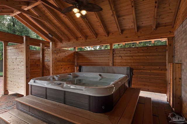 deck featuring a hot tub and ceiling fan