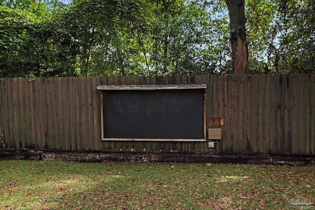 view of outbuilding featuring a lawn