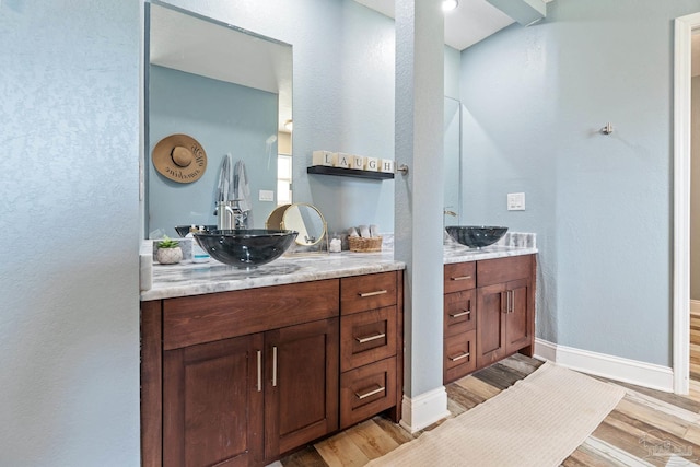 bathroom featuring hardwood / wood-style floors and vanity