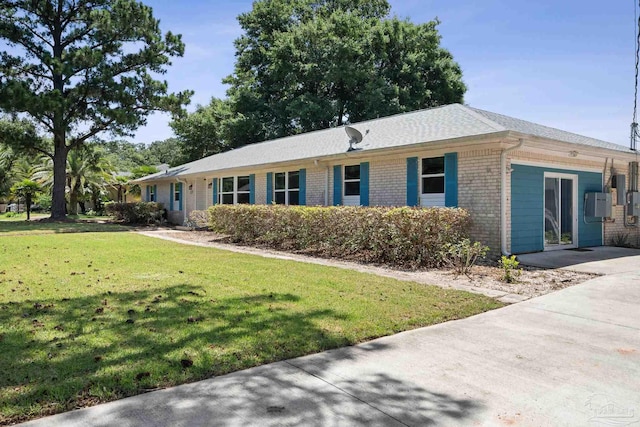 ranch-style house featuring a front lawn