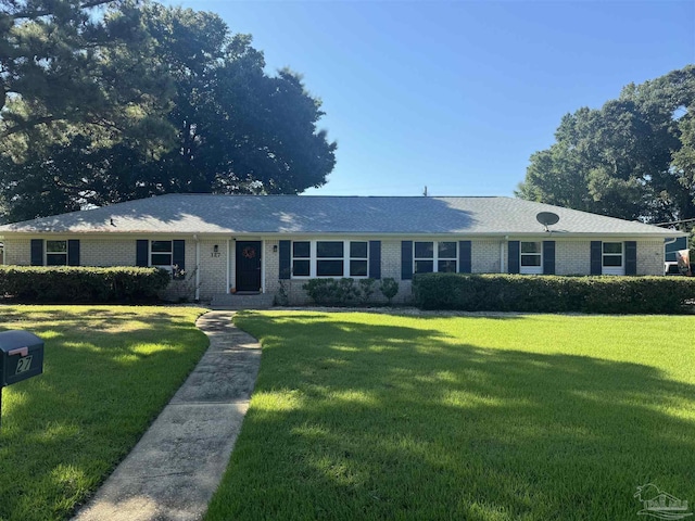 ranch-style home featuring a front yard