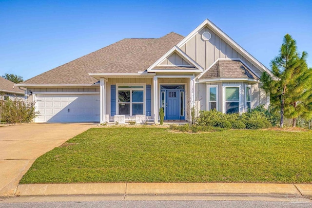 view of front facade featuring a garage and a front lawn