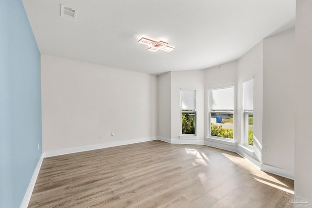 empty room with light wood-type flooring