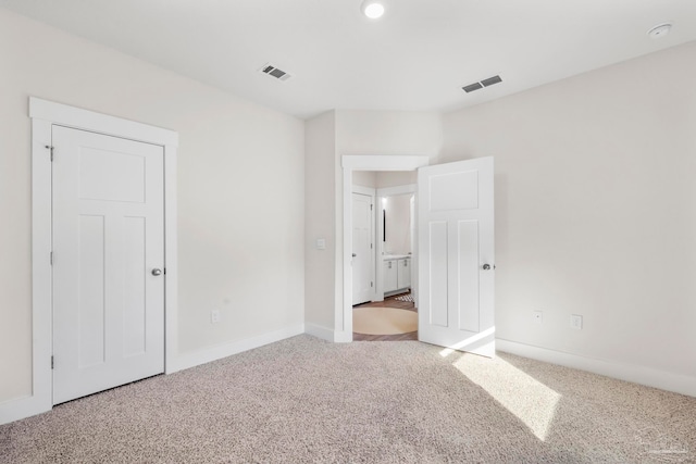 unfurnished bedroom with carpet