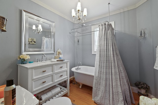 full bathroom with crown molding, a chandelier, vanity, hardwood / wood-style flooring, and plus walk in shower