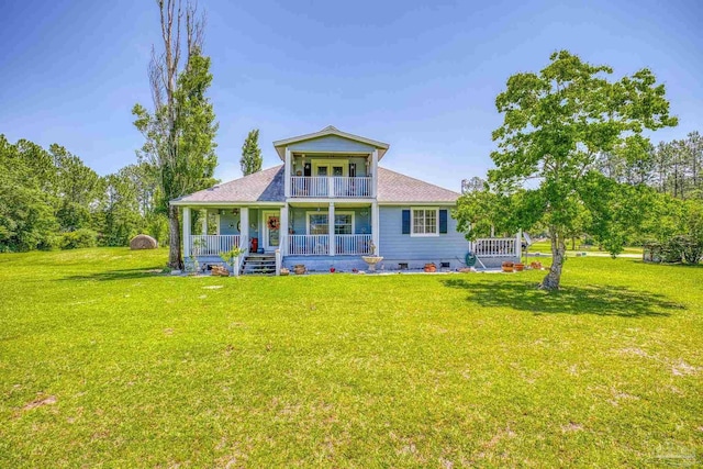 back of house featuring a yard, a balcony, and a porch