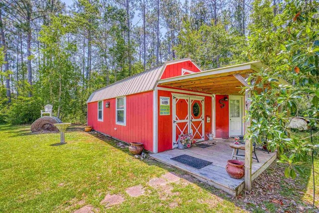 view of outbuilding with a yard