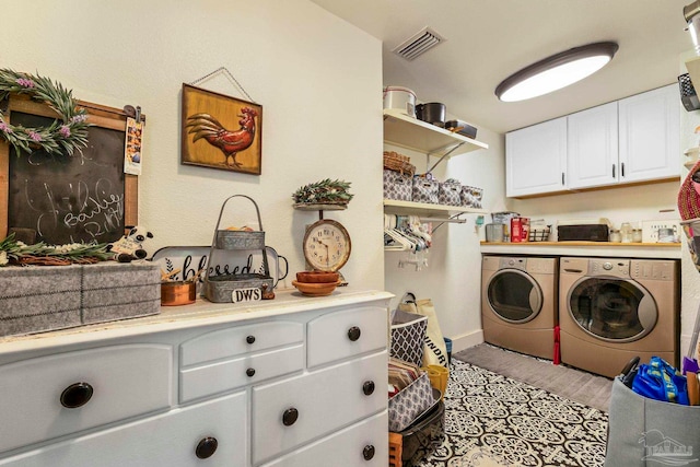 laundry area with cabinets and independent washer and dryer