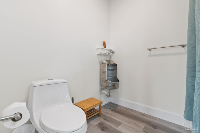 2032 Bay Point Blvd, Milton, FL 32583 - bathroom featuring toilet and wood finished floors