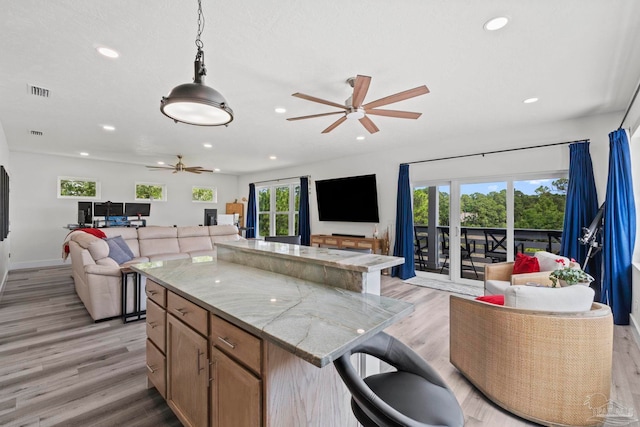 2032 Bay Point Blvd, Milton, FL 32583 - kitchen featuring open floor plan, a ceiling fan, recessed lighting, and light wood-type flooring