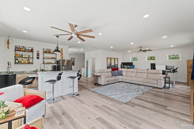 2032 Bay Point Blvd, Milton, FL 32583 - living area with a ceiling fan, bar with sink, recessed lighting, and light wood-type flooring