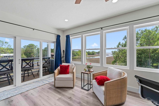 2032 Bay Point Blvd, Milton, FL 32583 - living area featuring a water view, a ceiling fan, light wood-style flooring, recessed lighting, and a textured ceiling