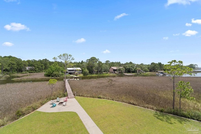 2032 Bay Point Blvd, Milton, FL 32583 - view of green lawn featuring a water view and a patio