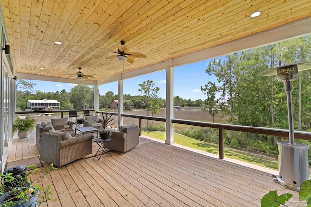 2032 Bay Point Blvd, Milton, FL 32583 - deck featuring outdoor lounge area, a ceiling fan, and view of wooded area