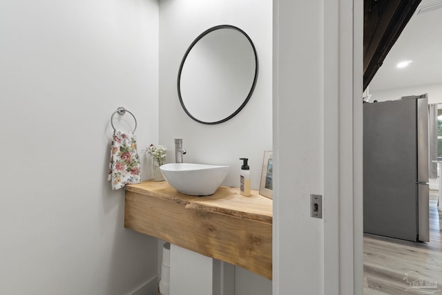 2032 Bay Point Blvd, Milton, FL 32583 - bathroom featuring a sink and wood finished floors
