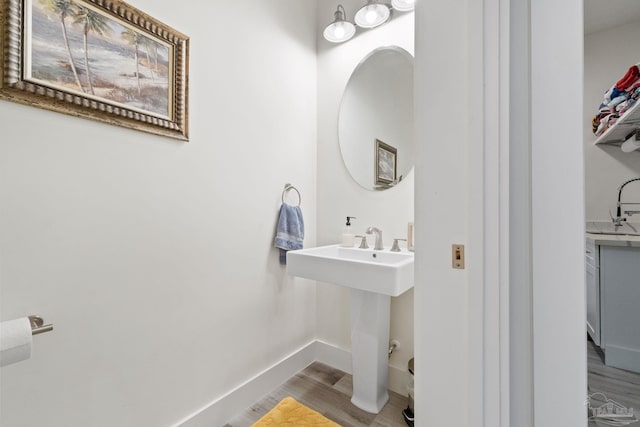 2032 Bay Point Blvd, Milton, FL 32583 - bathroom with wood finished floors and a sink