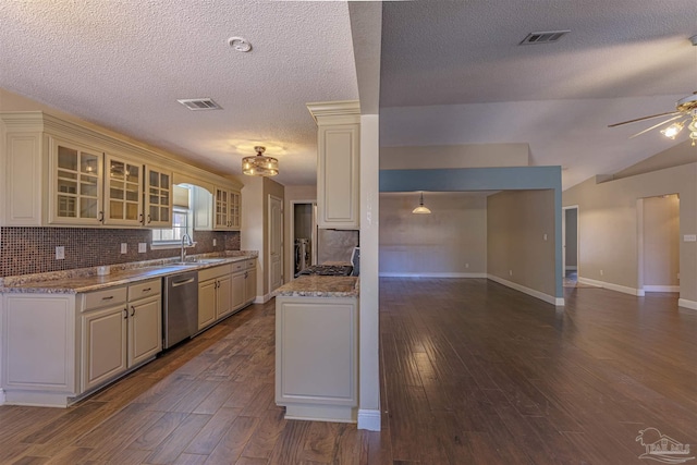 kitchen with decorative backsplash, light stone counters, ceiling fan, sink, and dishwasher