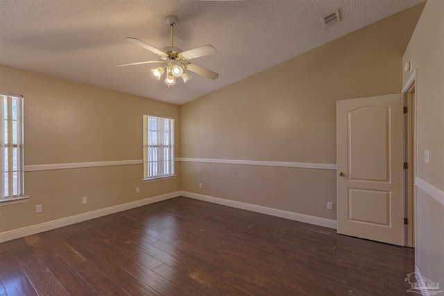 unfurnished room featuring ceiling fan, dark wood-type flooring, and a textured ceiling