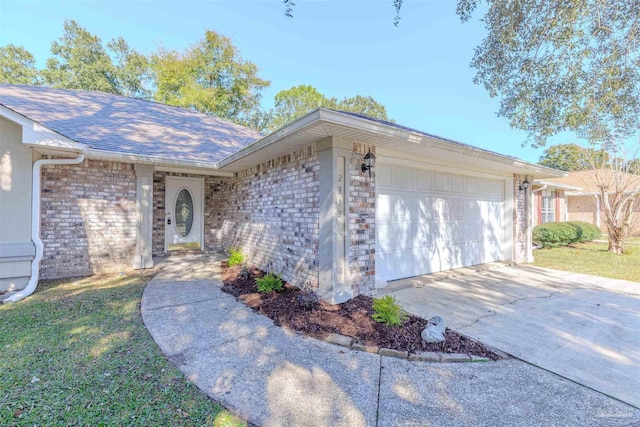 ranch-style home with a front yard and a garage