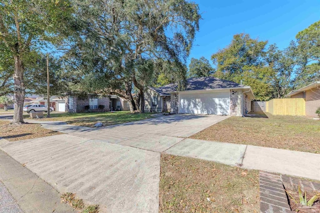 single story home with a front lawn and a garage