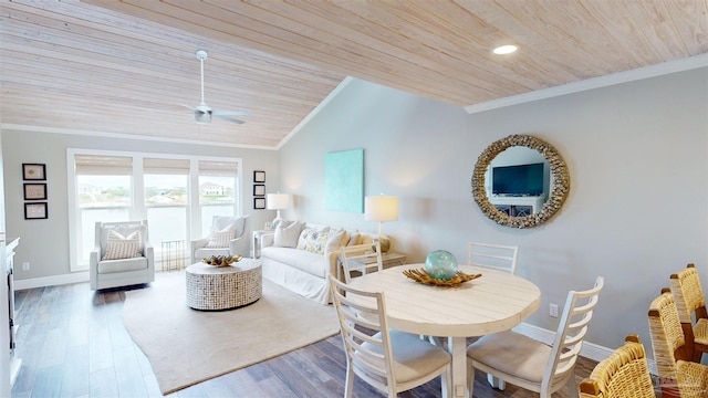 dining space with vaulted ceiling, hardwood / wood-style floors, ornamental molding, ceiling fan, and wooden ceiling