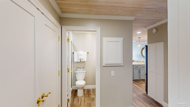 bathroom with wood-type flooring, toilet, and wooden ceiling