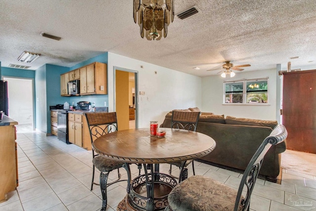 dining space with visible vents and light tile patterned floors