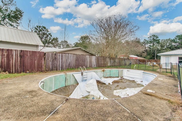 view of pool with a fenced backyard and a fenced in pool