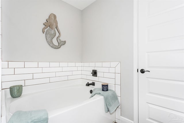 bathroom with a garden tub