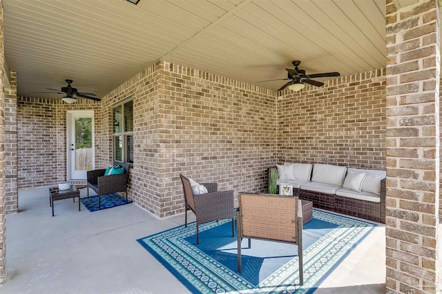 view of patio / terrace with an outdoor living space and a ceiling fan