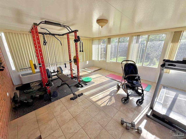 exercise area featuring tile patterned floors