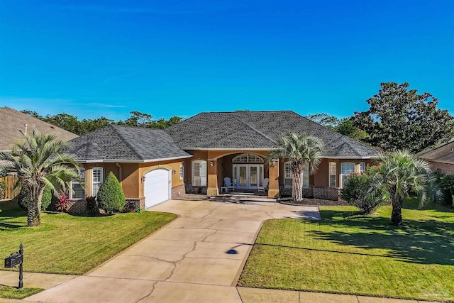 ranch-style home featuring covered porch, a garage, and a front lawn