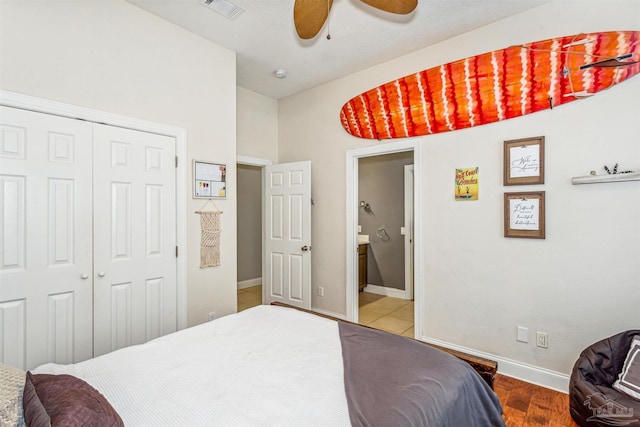 bedroom with ceiling fan, wood-type flooring, and a closet