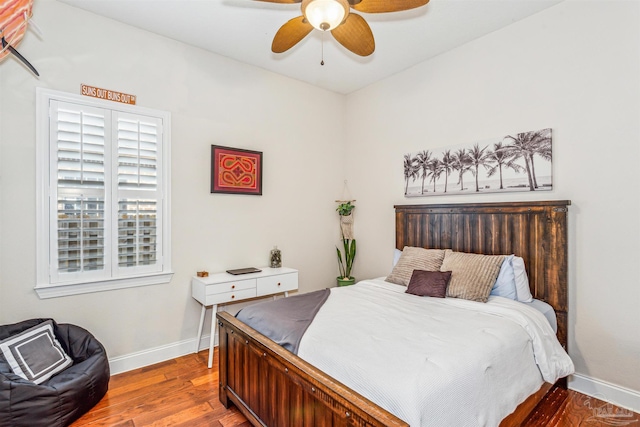 bedroom with ceiling fan and wood-type flooring