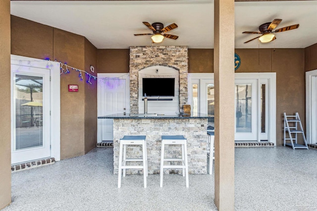 kitchen featuring ceiling fan