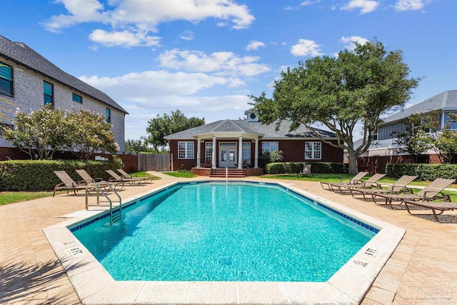 view of swimming pool with a patio