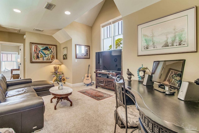 carpeted living room with vaulted ceiling