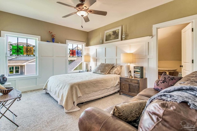 bedroom with ceiling fan and light colored carpet