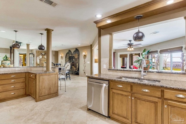 4552 Bayside Dr, Milton, FL 32583 - kitchen featuring visible vents, decorative columns, a sink, stainless steel dishwasher, and brown cabinets