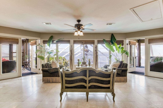 4552 Bayside Dr, Milton, FL 32583 - dining space with visible vents, a textured ceiling, and a ceiling fan