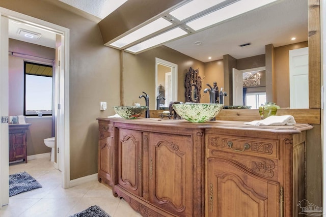 4552 Bayside Dr, Milton, FL 32583 - bathroom with visible vents, toilet, tile patterned flooring, baseboards, and vanity