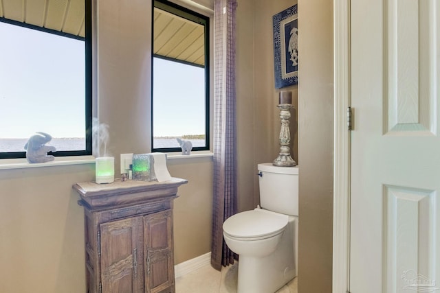 4552 Bayside Dr, Milton, FL 32583 - bathroom featuring baseboards, toilet, and tile patterned flooring