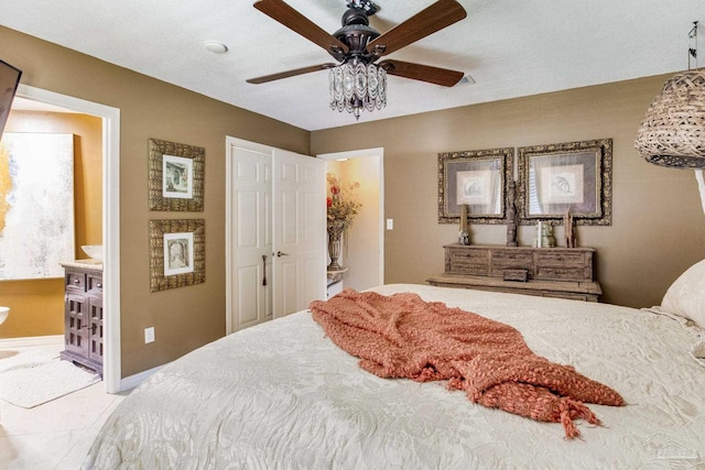 4552 Bayside Dr, Milton, FL 32583 - bedroom featuring a ceiling fan, baseboards, and ensuite bathroom