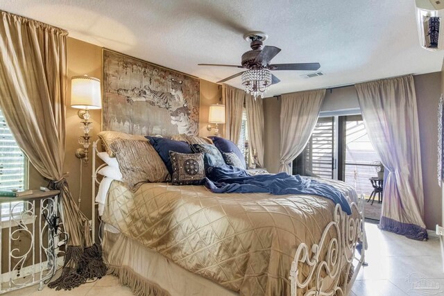 4552 Bayside Dr, Milton, FL 32583 - tiled bedroom with visible vents, a textured ceiling, ceiling fan, and access to outside